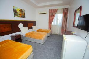 En eller flere senger på et rom på فندق ربا الحجاز