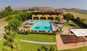 an aerial view of a resort with a swimming pool at Marina del Marchese Beach Resort in Botricello