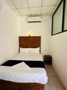 Lova arba lovos apgyvendinimo įstaigoje TCS Rooms Ezhilode Payyanur