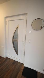 a white door with a picture of a boat at NEU! FeWo Großfelden 3 