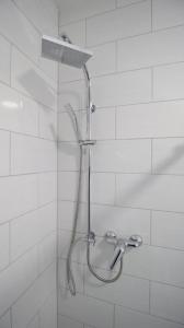 a shower with a shower head in a bathroom at NEU! FeWo Marburg 2 mit Balkon 