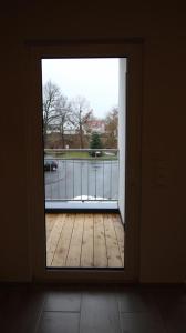 an open door with a view of a balcony at Neu! FeWo Lahnblick 1 