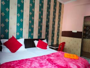 Postelja oz. postelje v sobi nastanitve Hotel Shri Hari Residency