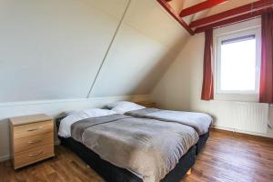 Cama o camas de una habitación en Klein Giethoorn -Vakantiehuis 11