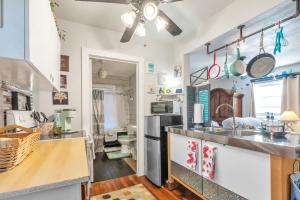 a kitchen with a sink and a counter at The Coziest Cottage in Waxahachie in Waxahachie