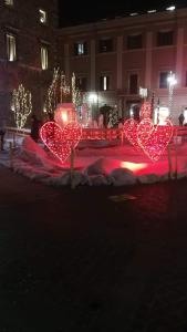 a group of heart lights on a street at night at La casa di Glenda bis in Terni