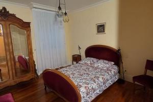Postel nebo postele na pokoji v ubytování Le Pavillon des Abrincates