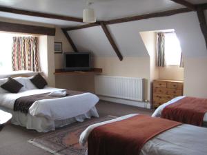 A bed or beds in a room at Malt House