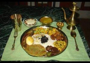 a plate of breakfast food on a table at Three Brothers Apartment and Hotel in Kathmandu