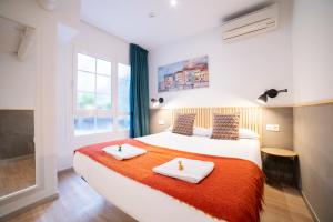 Postel nebo postele na pokoji v ubytování Koba Hostel