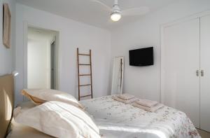 Ένα ή περισσότερα κρεβάτια σε δωμάτιο στο Nomad Malaga - Chic Apartament Center +11 φωτογραφίες