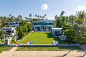 an aerial view of a house on the beach at Summer Estate Villa in Pilai Beach