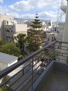 a balcony with a view of a city at New apartment in Kallithea in Athens