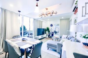 a dining room and living room with a table and chairs at Lazzlla beach front apartments in Hulhumale