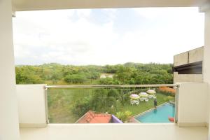 a view of a balcony with a view of a pool at Kurulu Villa Baddegama in Galle