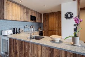 Η κουζίνα ή μικρή κουζίνα στο Madame Vacances Chalet Arda +10 φωτογραφίες