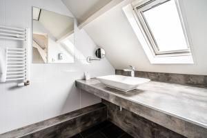 Een badkamer bij Hotel Hulst