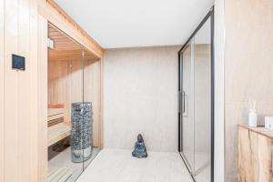 a shower with a glass door in a bathroom at Dům u Prokopského údolí in Prague +23 photos