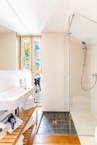 a bathroom with a shower and a sink at Quercus Appartements contactless check-in in Patergassen