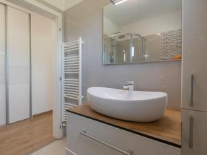 a bathroom with a white sink and a mirror at Villa Drazana in Imotski +29 photos