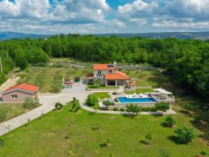 an aerial view of a house with a swimming pool at Villa Drazana in Imotski