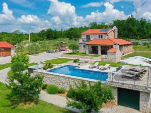 an aerial view of a house with a swimming pool at Villa Drazana in Imotski
