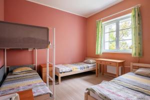 Postel nebo postele na pokoji v ubytování Staicele - Learning and Training Hub