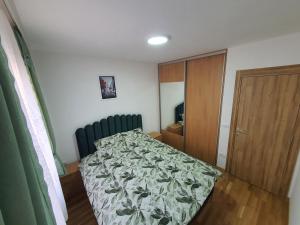 Giường trong phòng chung tại Apartman Vranic Zlatibor