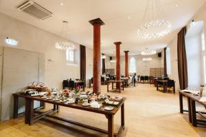 a large room with a table with food on it at Schloss Beuchow in Lübbenau