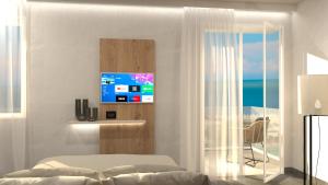 TV a/nebo společenská místnost v ubytování Hotel Miramare Chioggia Sottomarina