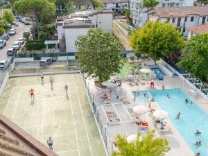 an overhead view of a swimming pool with people in it at Hotel Marina Beach in Ravenna
