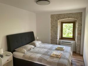 Postel nebo postele na pokoji v ubytování Apartment Makjanić