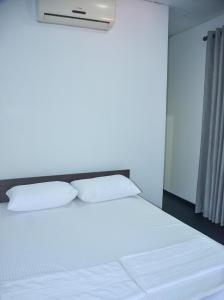 Ліжко або ліжка в номері StayBridge Residence