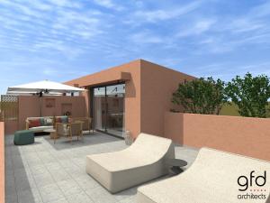 eine möblierte Terrasse mit Sonnenschirm in der Unterkunft Kiani Beach Resort Family All Inclusive in Kalyves