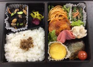 a lunch box with rice and vegetables and food at Blossom Hotel Hirosaki in Hirosaki