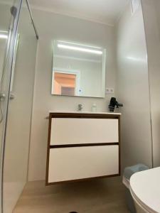 a bathroom with a sink and a mirror at Apartamento Vista al mar in Dehesa de Campoamor