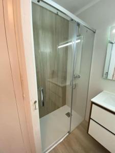 a shower with a glass door in a bathroom at Apartamento Vista al mar in Dehesa de Campoamor