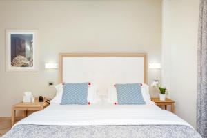 Rúm í herbergi á Park Hotel Argento