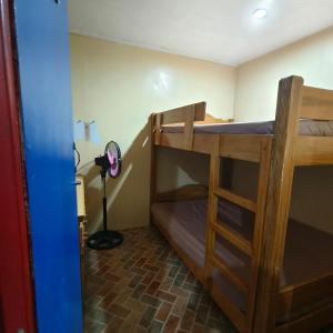 a bedroom with two bunk beds in a room at Budget Accommodation near town in Baguio