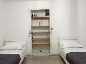 Posteľ alebo postele v izbe v ubytovaní Paloma center town apartment