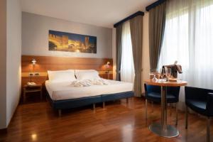 Postel nebo postele na pokoji v ubytování Best Western Hotel Fiera Verona + 37 fotografií