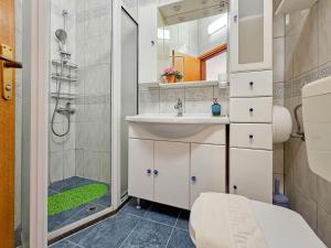 a bathroom with a sink and a shower at Zigante in Novigrad Istria +24 photos