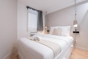 En eller flere senge i et værelse på Lille centre - Nice flat with terrace!