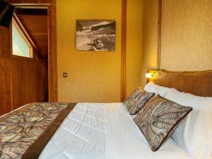 Letto o letti in una camera di Hotel Togo Monte Terminillo