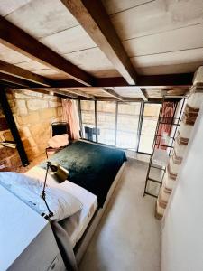 a room with two bunk beds and a ladder at The Hidden Gem Of Bordeaux in Lormont