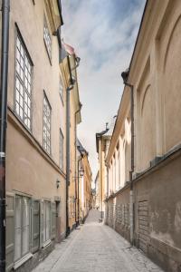 an empty street in a city with buildings at The architects' house in Stockholm