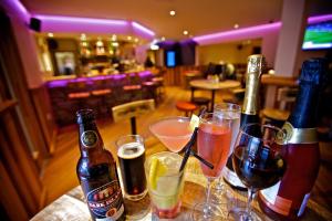 a table with several bottles and glasses of wine at St Ola Hotel in Kirkwall