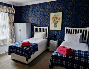 Postel nebo postele na pokoji v ubytování Eliza House