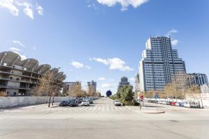 an empty street in a city with tall buildings at Zona Garbí - B in Valencia