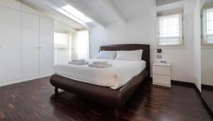 a bedroom with a large bed with white sheets at Italianway Comfort - Torino 57 B in Milan